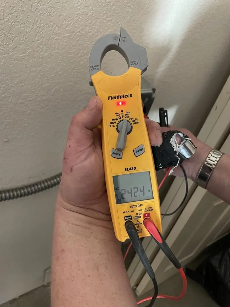 Voltage testing with clamp meter during Outlet Installation in Rock Springs